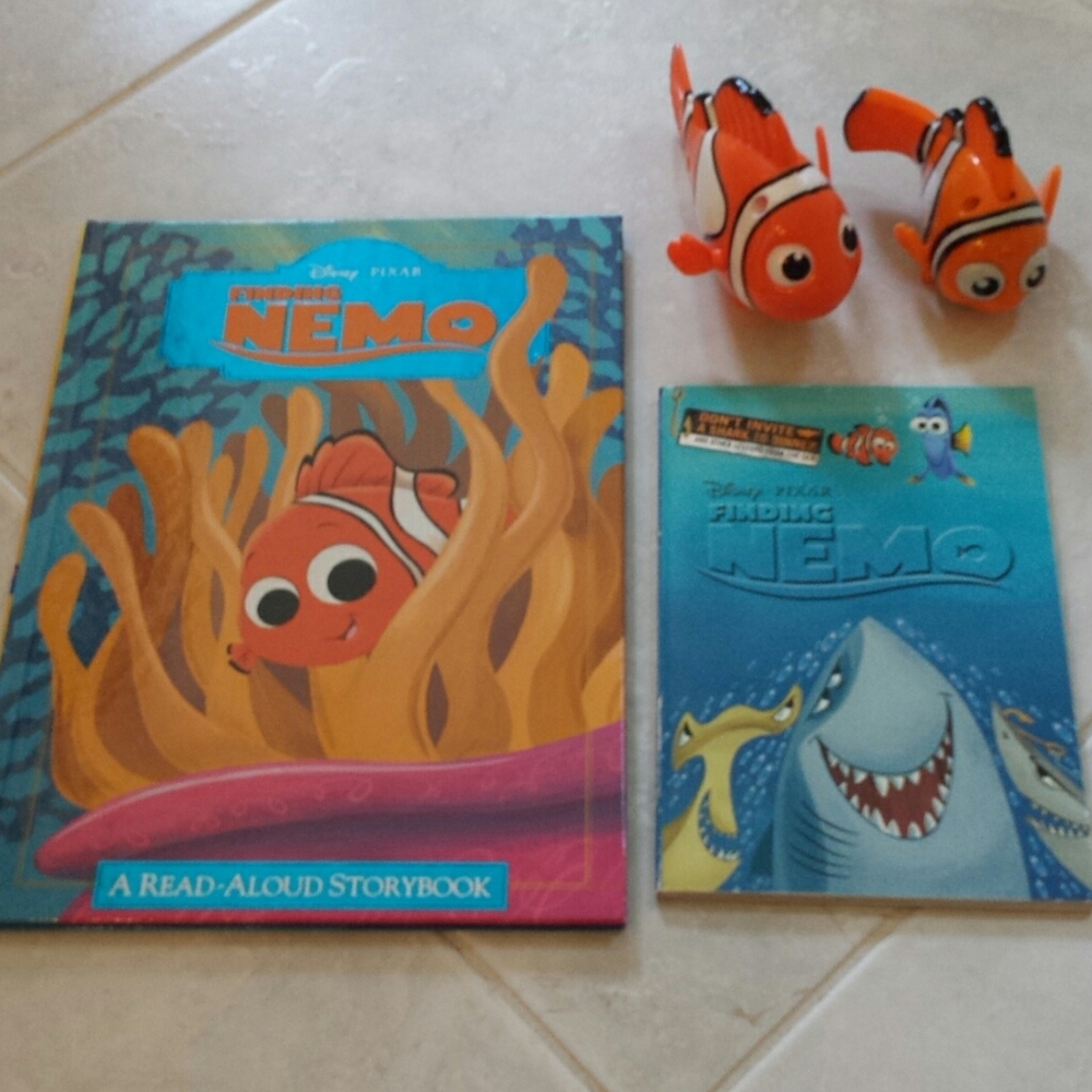 2 Finding Nemo books and 2 Nemo Action Figures